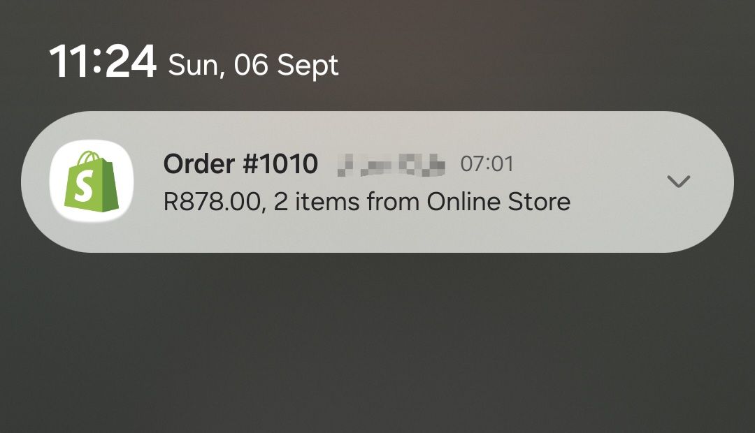 Mohamed’s order notification showing R878 for two items, with identifying details already obscured.